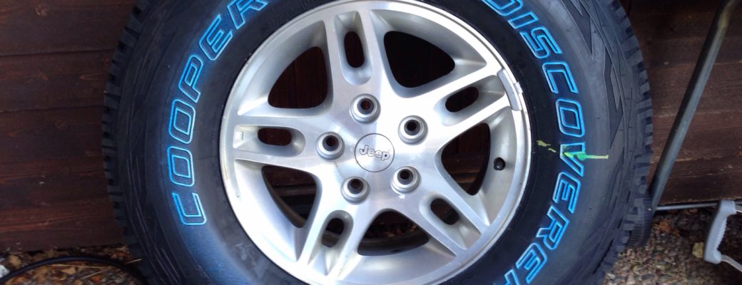 Cooper Discoverer A/T3 on stock Jeep wheels.