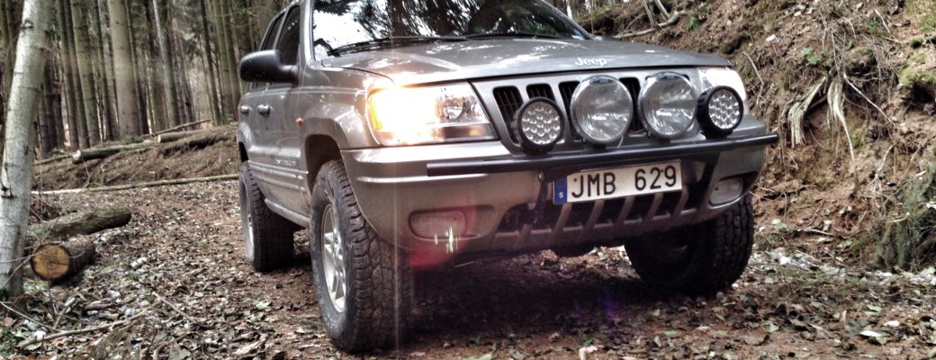 Jeep WJ on lumber trail, close